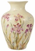 A Victorian blush ivory baluster vase painted with colourful sprays of iris flowers and leaves, each