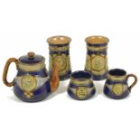 A small collection of Royal Doulton commemorative Nelson ceramics comprising a stoneware blue and