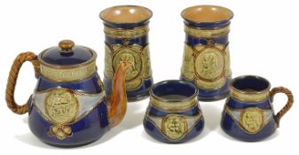 A small collection of Royal Doulton commemorative Nelson ceramics comprising a stoneware blue and