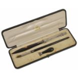 An Asprey tortoiseshell and silver pen set hallmarked London 1916 with envelope opener, seal and