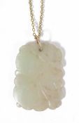 A mutton fat jade pendant carved and pierced, on gold plated chain 4.6 x 3.3cmCondition: In good