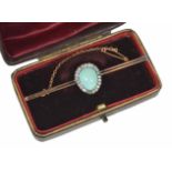 A good quality Edwardian turquoise and diamond brooch having central tear shaped turquoise of even