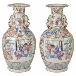 A pair of 19th century Canton famille rose baluster vases painted in the traditional palette with