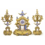 A French gilt clock garniture the clock with circular dial with Roman numerals, mounted with an