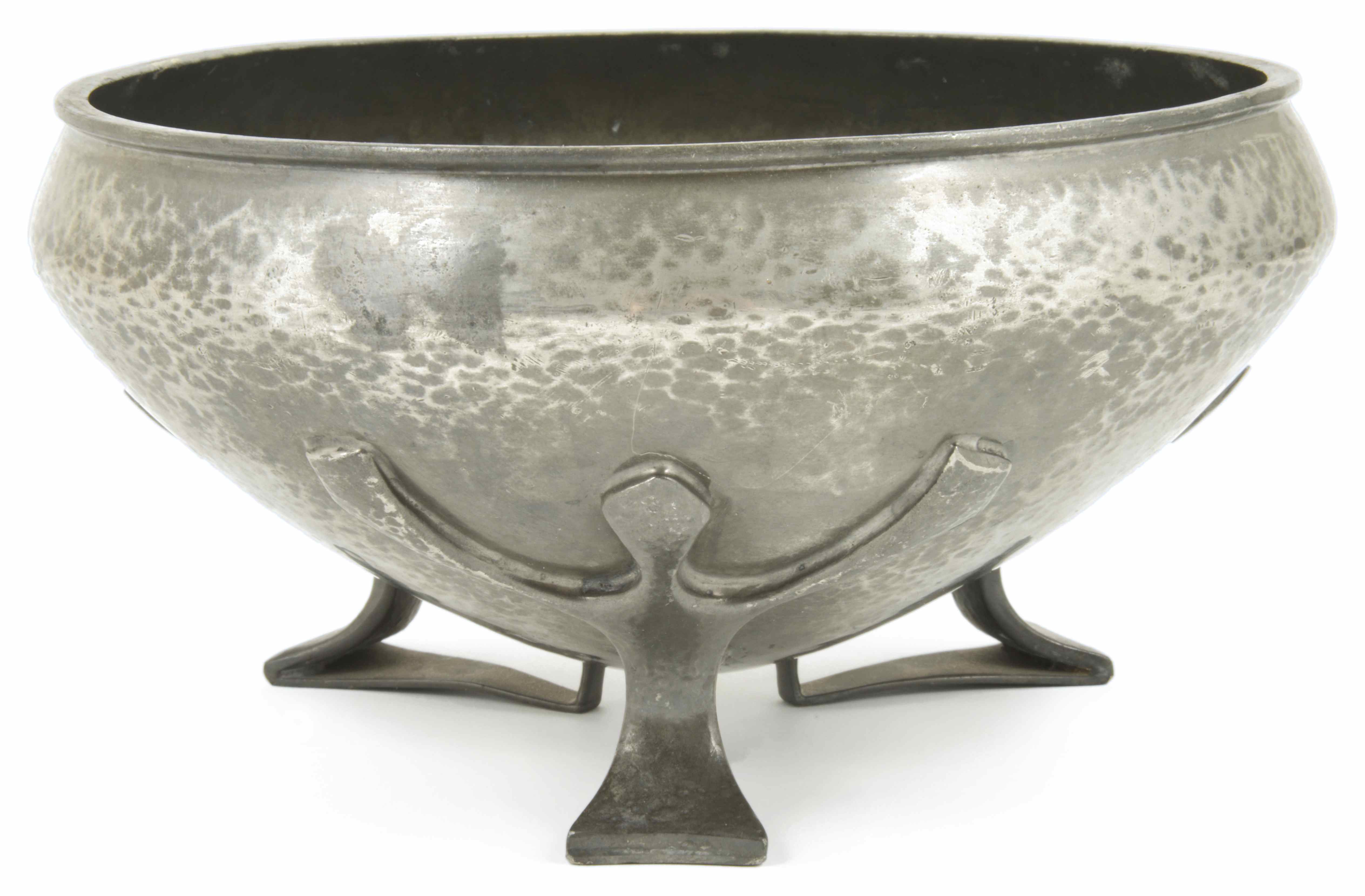 A Liberty Tudric pewter bowl with inverted rim, raised on three stylised feet, stamped on the