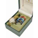 A vintage Gucci dress watch with interchangeable coloured dial trims, original fitted Gucci box