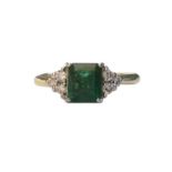 A square cut emerald and diamond set ring the central emerald of good colour and approx. 1.00 ct.