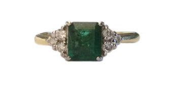 A square cut emerald and diamond set ring the central emerald of good colour and approx. 1.00 ct.