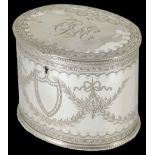 A good Victorian silver plated tea caddy of oval form decorated with swags, bows and monogram to the