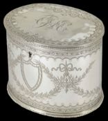 A good Victorian silver plated tea caddy of oval form decorated with swags, bows and monogram to the