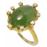 An unusual Continental spinach green jade and diamond fancy ring with central oval jade within a