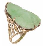 An unusual carved Buddha jade ring the mount of foliate yellow metal design, test as gold Size