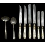 A small collection of flatware comprising three sets of knives with mother of pearl and silver