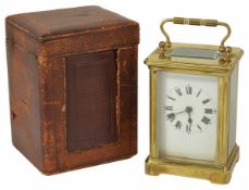 A French cased four glass brass carriage clock the white enamel dial with black Roman numerals and