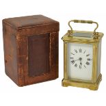 A French cased four glass brass carriage clock the white enamel dial with black Roman numerals and