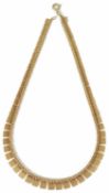 A contemporary Etruscan style 9ct. gold panel necklace, fully articulated and graduated to either