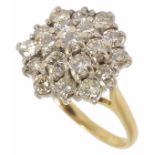 A large tiered diamond cluster ring of hexagonal form, the stones even sized and approx. total