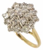 A large tiered diamond cluster ring of hexagonal form, the stones even sized and approx. total