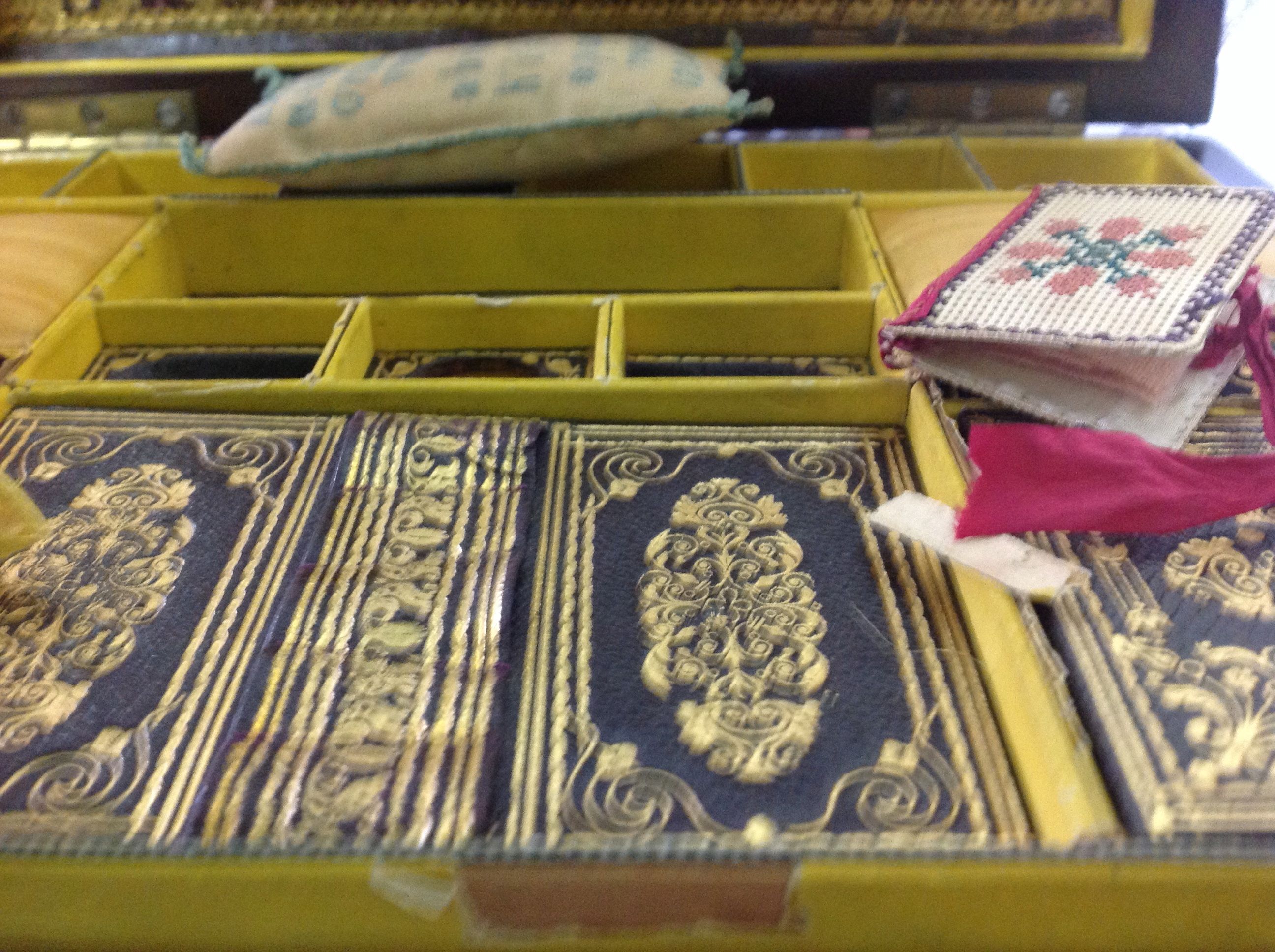 A late mahogany sewing box of sarcophagus form with ring handles to the side, the lid opening to - Image 2 of 3