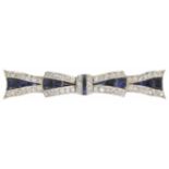 A high Art Deco sapphire and diamond set fancy bow brooch of elongated form with central sapphires