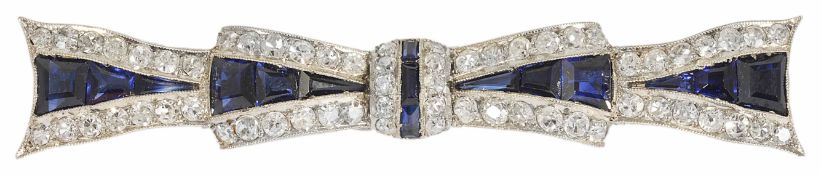 A high Art Deco sapphire and diamond set fancy bow brooch of elongated form with central sapphires