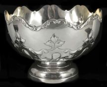 An Edwardian silver rose bowl hallmarked Sheffield 1909, with fluted rim and embossed scroll