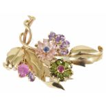 An attractive multi coloured gem set floral cocktail clip, circa 1940 formed as a stylised bough