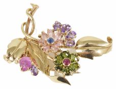 An attractive multi coloured gem set floral cocktail clip, circa 1940 formed as a stylised bough