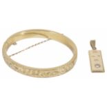 A 9ct gold diamond set pendant ingot together with a 9ct gold scroll engraved hollow hinged bangle