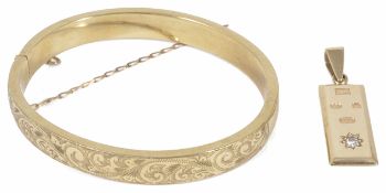 A 9ct gold diamond set pendant ingot together with a 9ct gold scroll engraved hollow hinged bangle