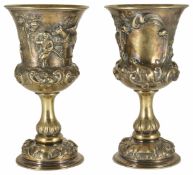 A pair of Victorian silver gilt embossed and repoussé goblets hallmarked London 1858, decorated with