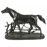 A late 20th century Russian cast iron model of a thoroughbred realistically modelled standing