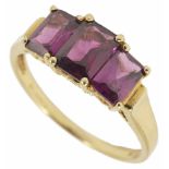 A continental three stone rectangular cut amethyst ring in 9K marked mount, in associated box.