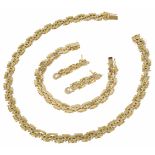 A suite of 18ct gold Continental jewellery comprising of necklace, bracelet and earrings of matching