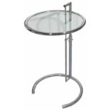 An Eileen Gray style adjustable chrome and glass table the table top of circular form with