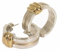 A pair of heavy Tiffany and Co two tone silver hoop earrings dated 1995 in original pouch and box.