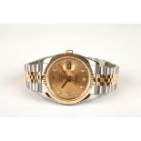 A Rolex Oyster perpetual datejust wristwatch ref:116233 the circular champagne dial with raised