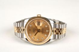 A Rolex Oyster perpetual datejust wristwatch ref:116233 the circular champagne dial with raised