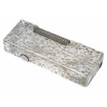A Dunhill silver plated rectangular lighter with overall textured finish, wheel action and flip