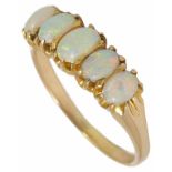 A five stone opal set half hoop ring the opals of good colour and in yellow metal mount, tests for