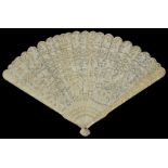 An early 20th century Chinese Canton carved ivory fan finely carved and pierced to front with