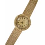 A ladies 'Certina' 9ct gold wind up bracelet watch, the circular dial with baton markers and soft