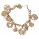 A 9ct gold curb link charm bracelet with heart padlock fastening, hung with a variety of charms