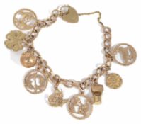 A 9ct gold curb link charm bracelet with heart padlock fastening, hung with a variety of charms