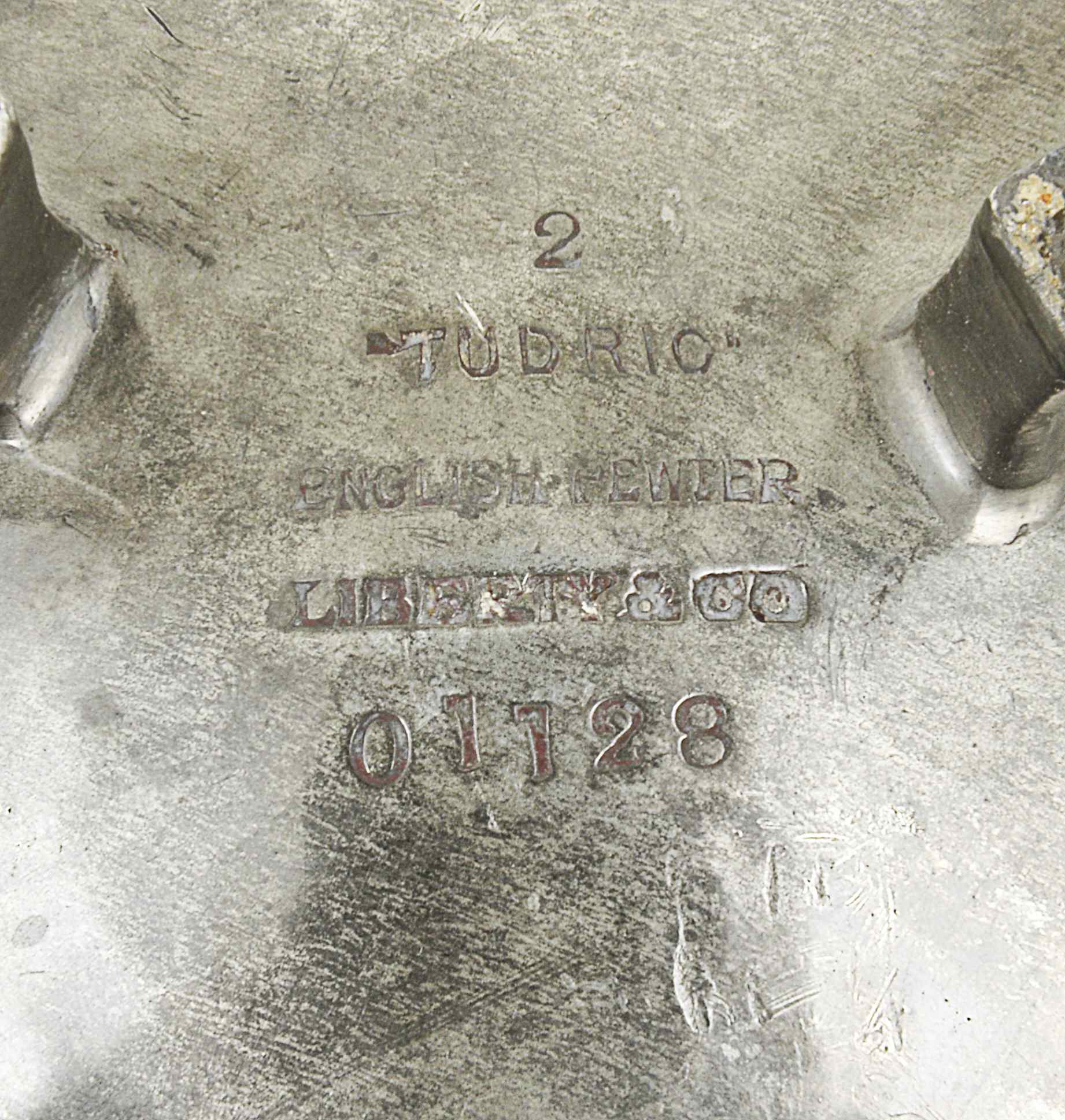 A Liberty Tudric pewter bowl with inverted rim, raised on three stylised feet, stamped on the - Image 2 of 2