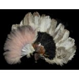 A collection of three 1930's feather fans largest fan with cream and brown ostrich feathers and