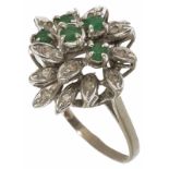 An emerald and diamond set floral cluster cocktail ring, circa 1970 with 5 central emeralds within a