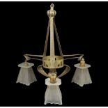 An Arts and Crafts triple hanging light with metal hanging body fitted with three glass shades