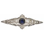 An Art Deco filigree gem and diamond brooch with central blue synthetic sapphire (untested) within a