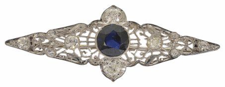 An Art Deco filigree gem and diamond brooch with central blue synthetic sapphire (untested) within a